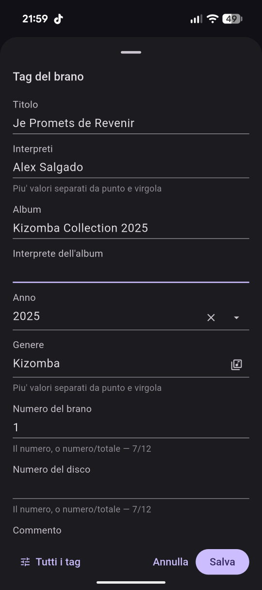 The tag editor: title, artists, album, year, genre and track number, with Save and Cancel.